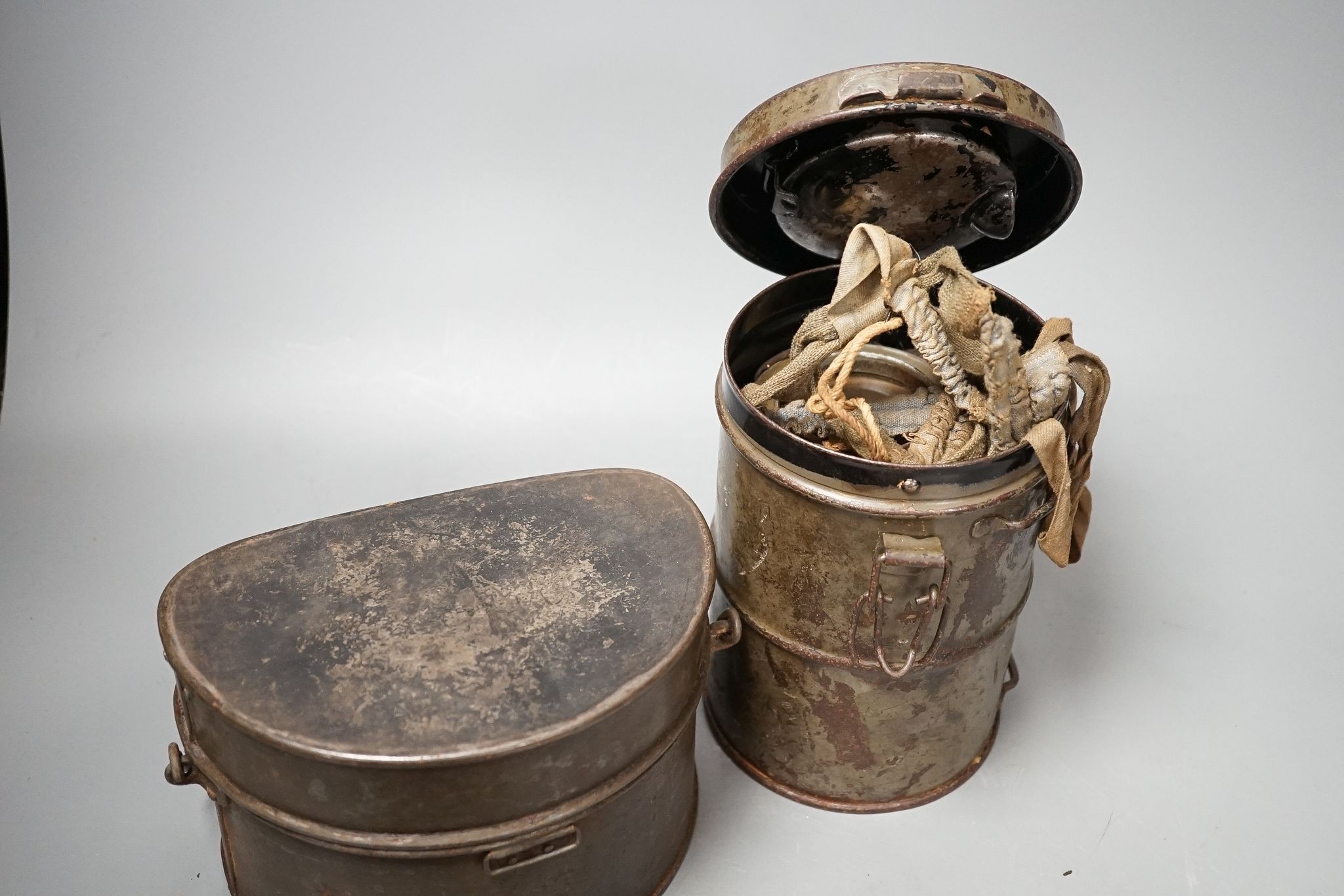 WWI German gas mask, two German trench mess tins and a German leather belt case